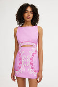 Pink embroidered cutout mini dress with sleeveless boat neck and front waist cutout