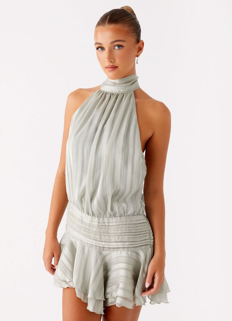 Front close view of light blue halter mini dress with gathered neckline and layered hem
