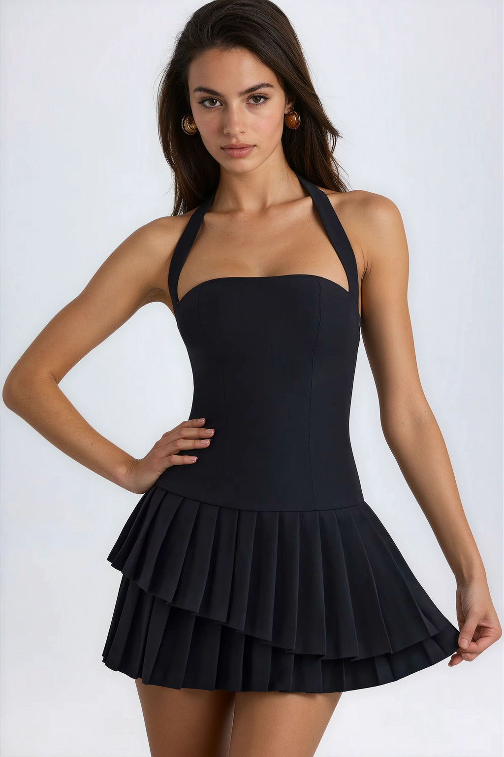 Black halterneck mini dress with pleated layered skirt and fitted bodice