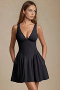 Black V neck mini dress with scalloped trim and fitted waist, front view