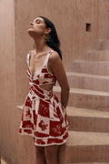 Red and white floral cut out mini dress with scalloped trim, wedding guest dress front view