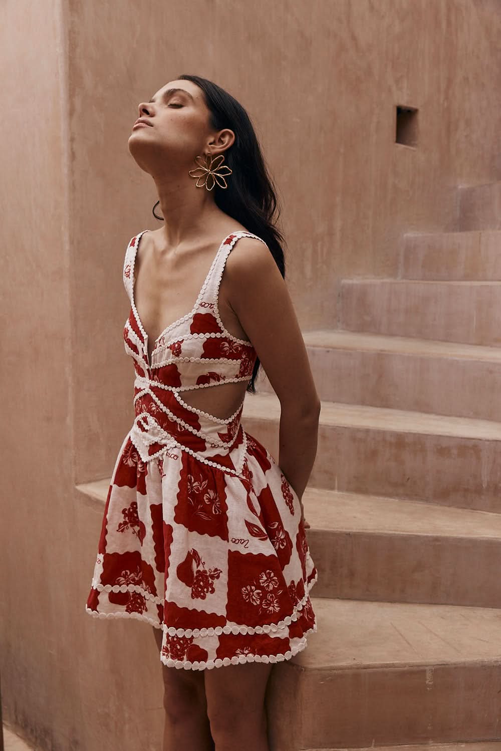 Red and white floral cut out mini dress with scalloped trim, wedding guest dress front view