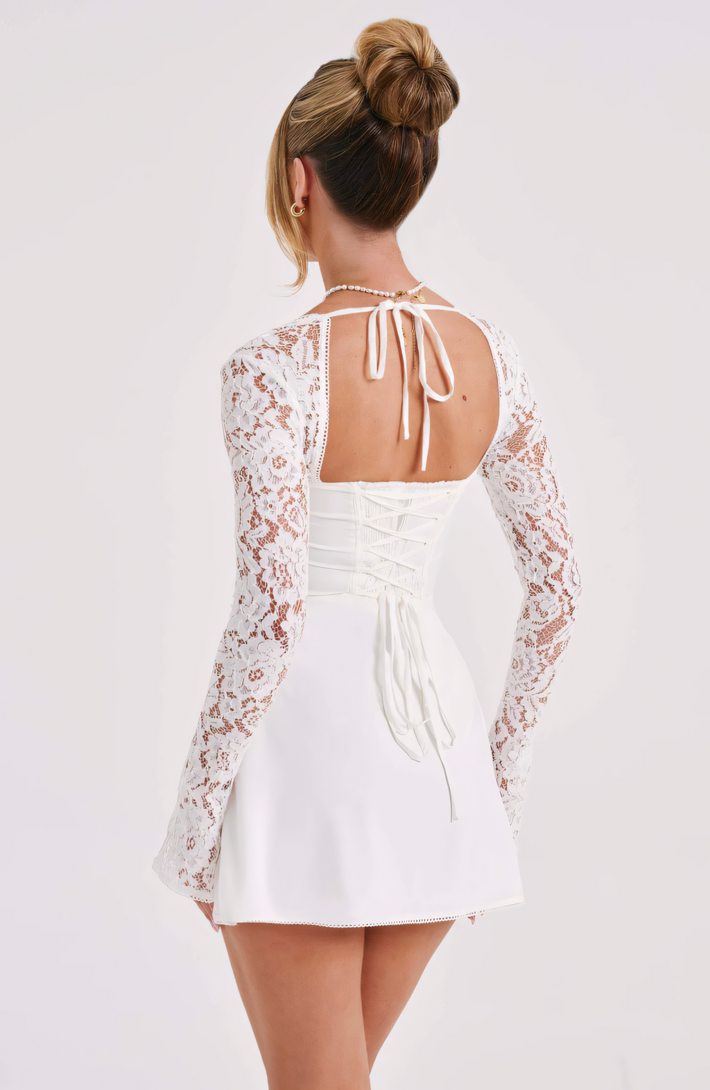 Back view white lace square neck mini dress with lace-up corset back and halter tie, wedding guest dress