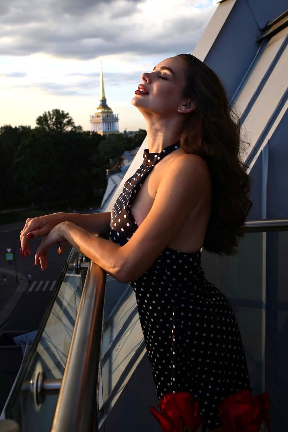 Side view black polka dot halter mini dress with open sides, evening wedding guest dress