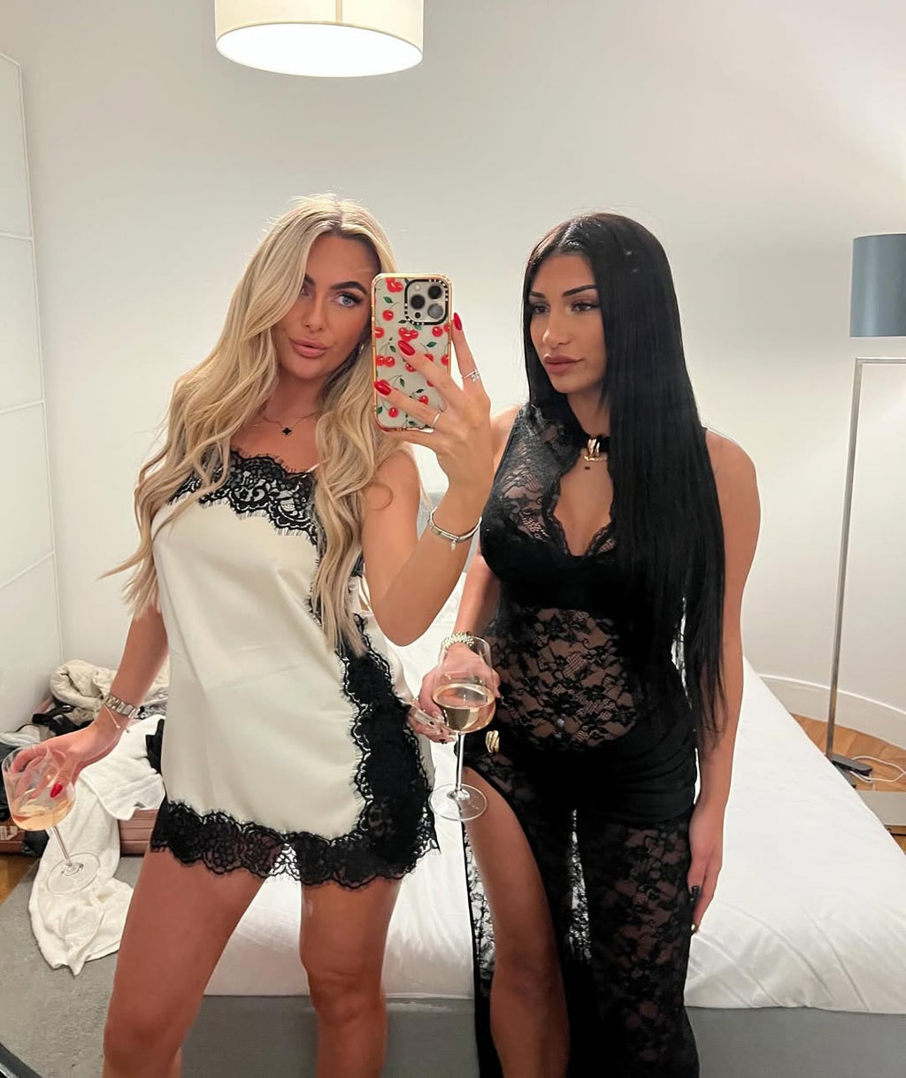 White satin lace mini dress styled with black lace outfit in a mirror selfie