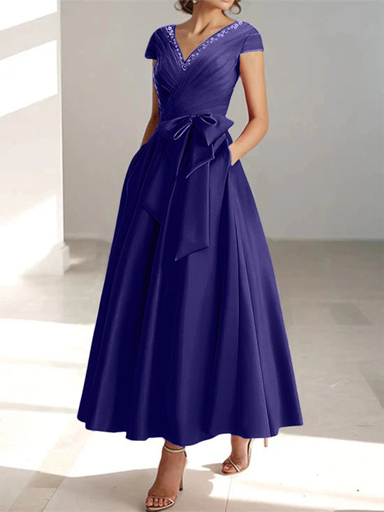 Navy blue a-line midi dress with v-neck, short sleeves, and side pockets