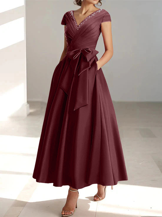 Deep burgundy a-line midi dress with wrapped v-neck and short sleeves
