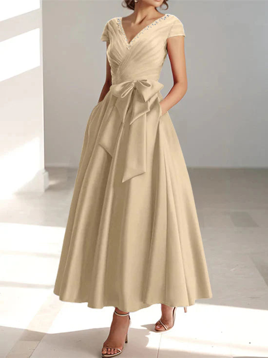 Champagne beige a-line midi dress with v-neck and short sleeves