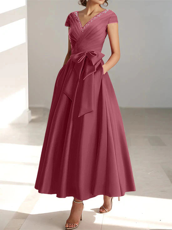 Mauve a-line midi dress with v-neckline, short sleeves, and pockets