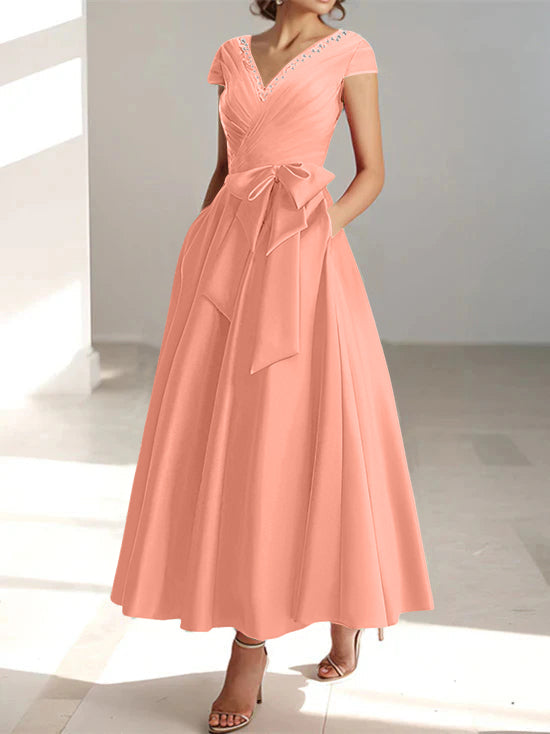 Coral pink A-line midi dress with V-neck, short sleeves, and side pockets