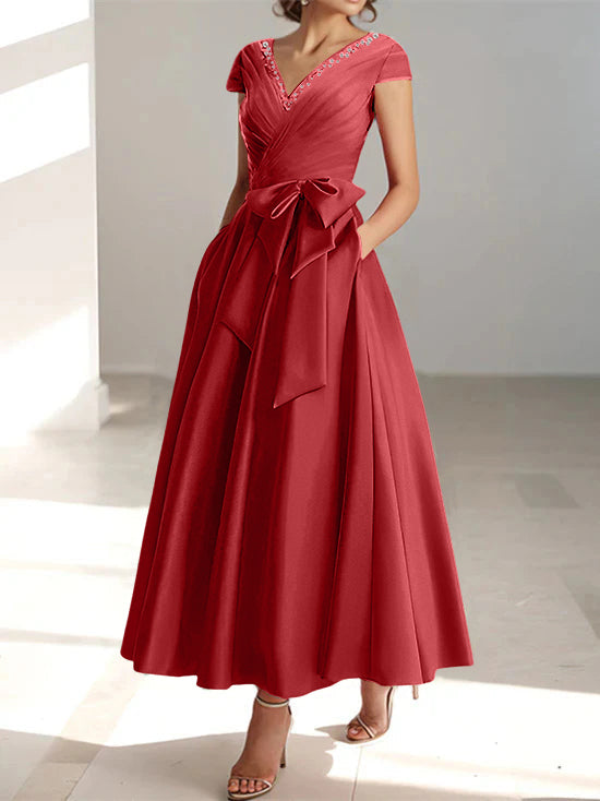Burgundy red A-line midi dress with V-neck, short sleeves, and functional pockets