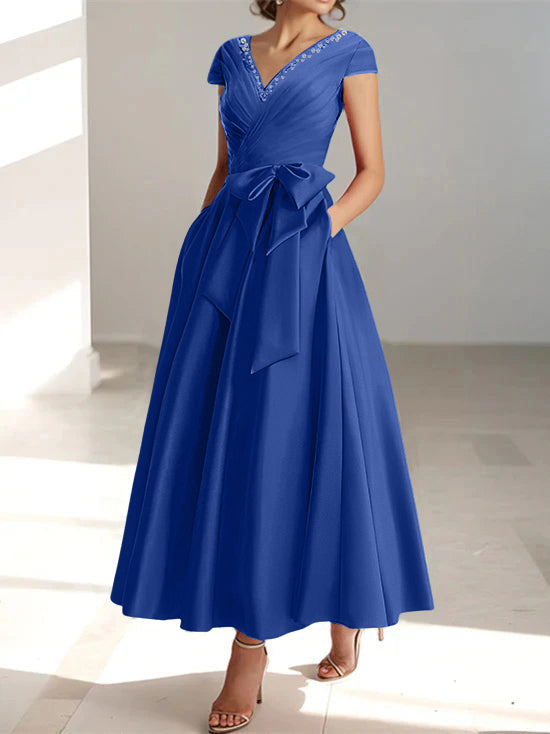 Royal blue A-line midi dress with V-neck, short sleeves, and side pockets