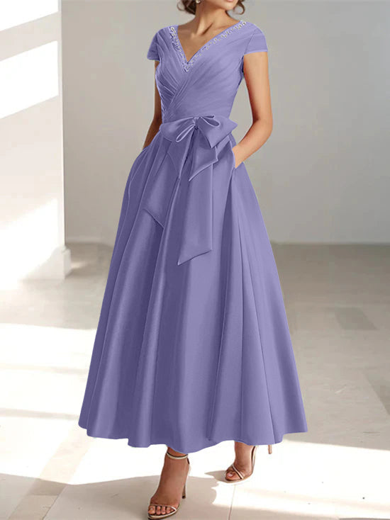 Lavender A-line midi dress with V-neck, short sleeves, and side pockets