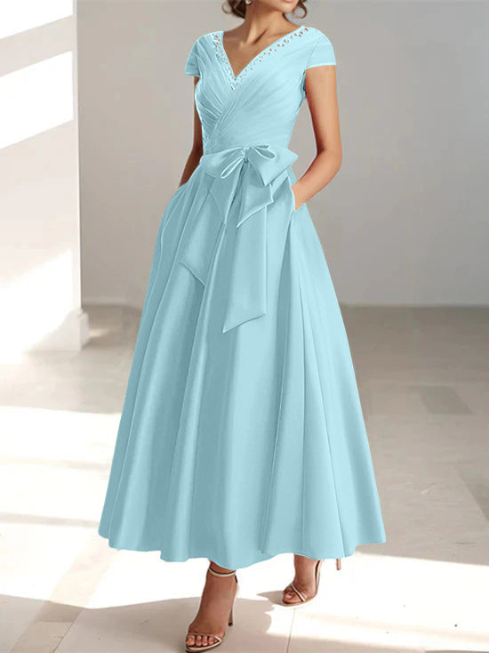 Light blue A-line midi dress with V-neck, short sleeves, and pockets