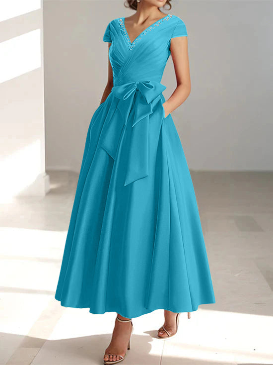 Teal blue A-line midi dress with V-neck, short sleeves, and side pockets