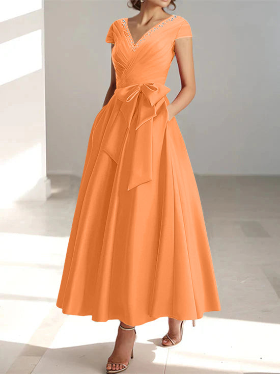 Bright orange A-line midi dress with V-neck, short sleeves, and pockets