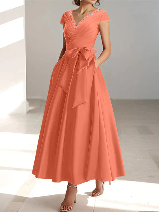 Coral A-line midi dress with V-neck, short sleeves, and side pockets