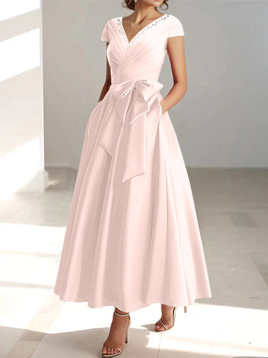 Blush pink wrap midi dress with short sleeves and front pockets