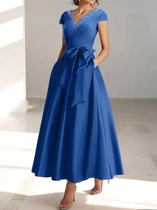 Navy blue A-line midi dress with v-neck, short sleeves, and front tie