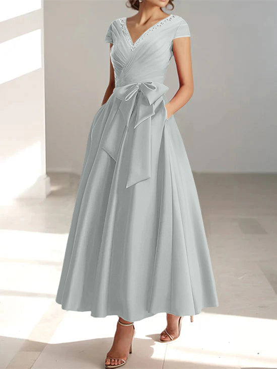 Gray A-line midi dress with v-neckline, short sleeves, and pockets