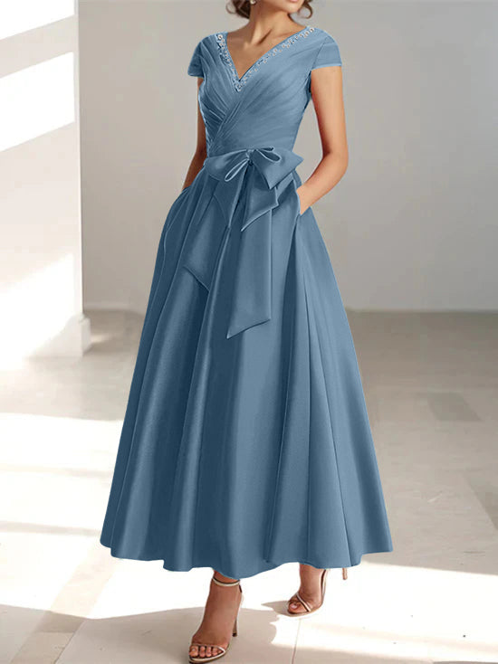 Slate blue A-line midi dress with v-neck, short sleeves, and front pockets