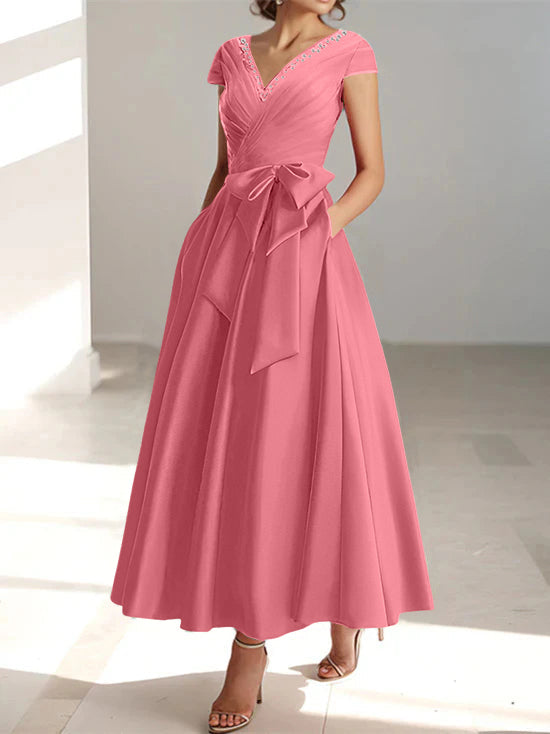 Rose pink a-line midi dress with v-neck, short sleeves, and side pockets