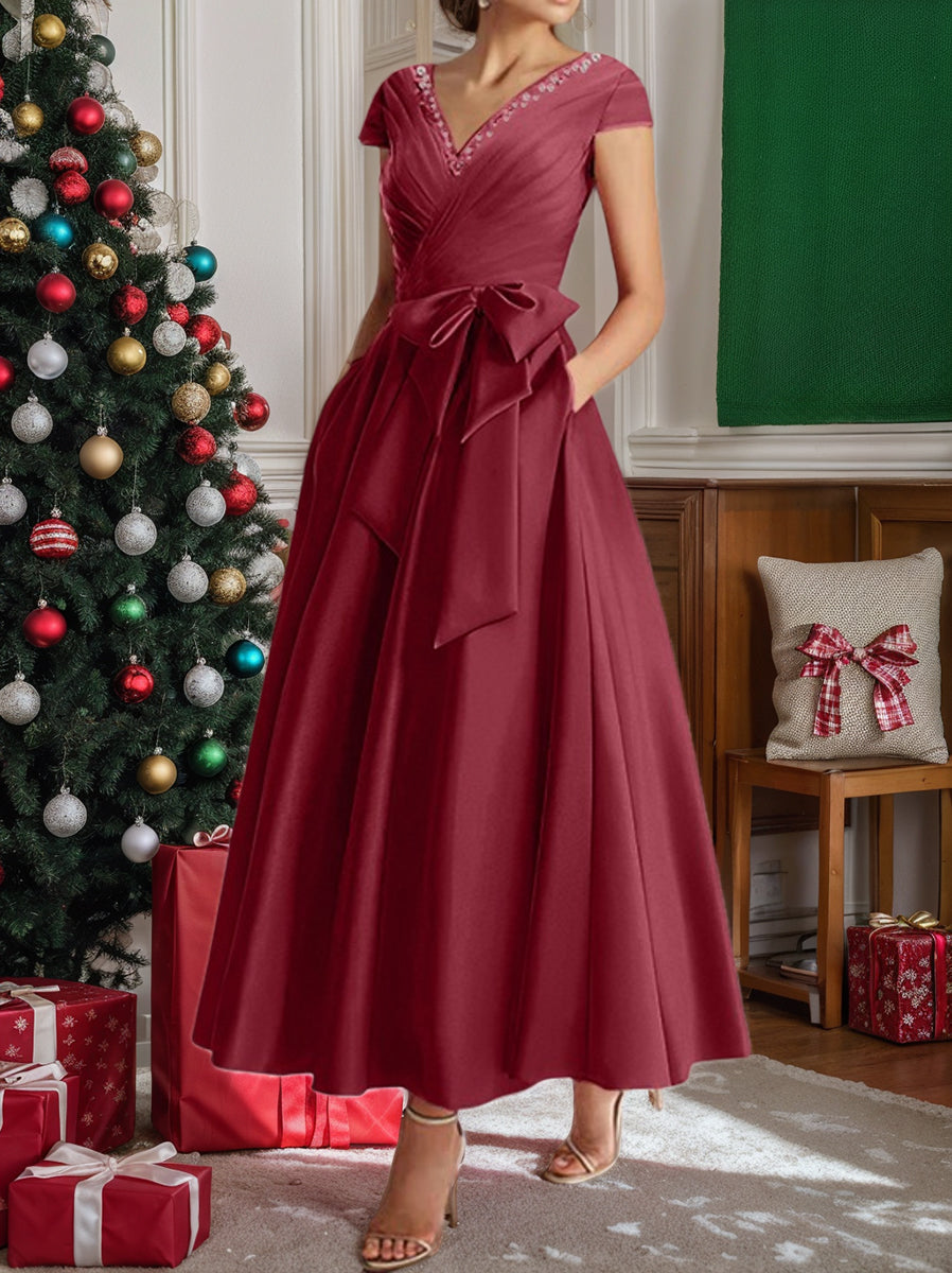 Burgundy a-line midi dress with v-neck, short sleeves, pockets, holiday styling