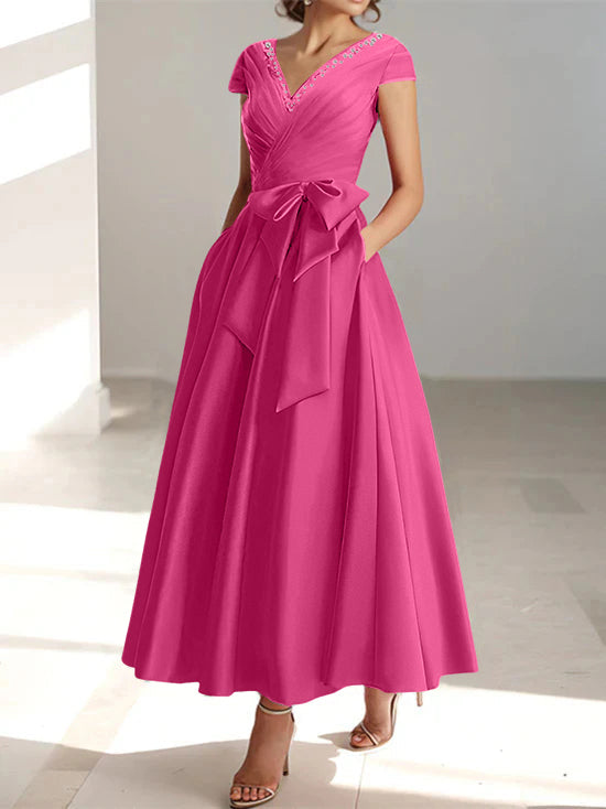 Magenta A-line midi dress with V-neck, short sleeves, and functional pockets