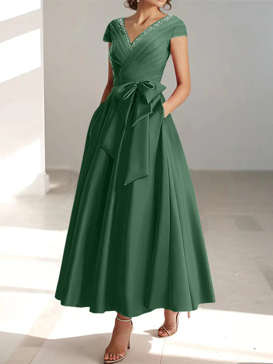 Forest green A-line midi dress with V-neck, short sleeves, and waist tie