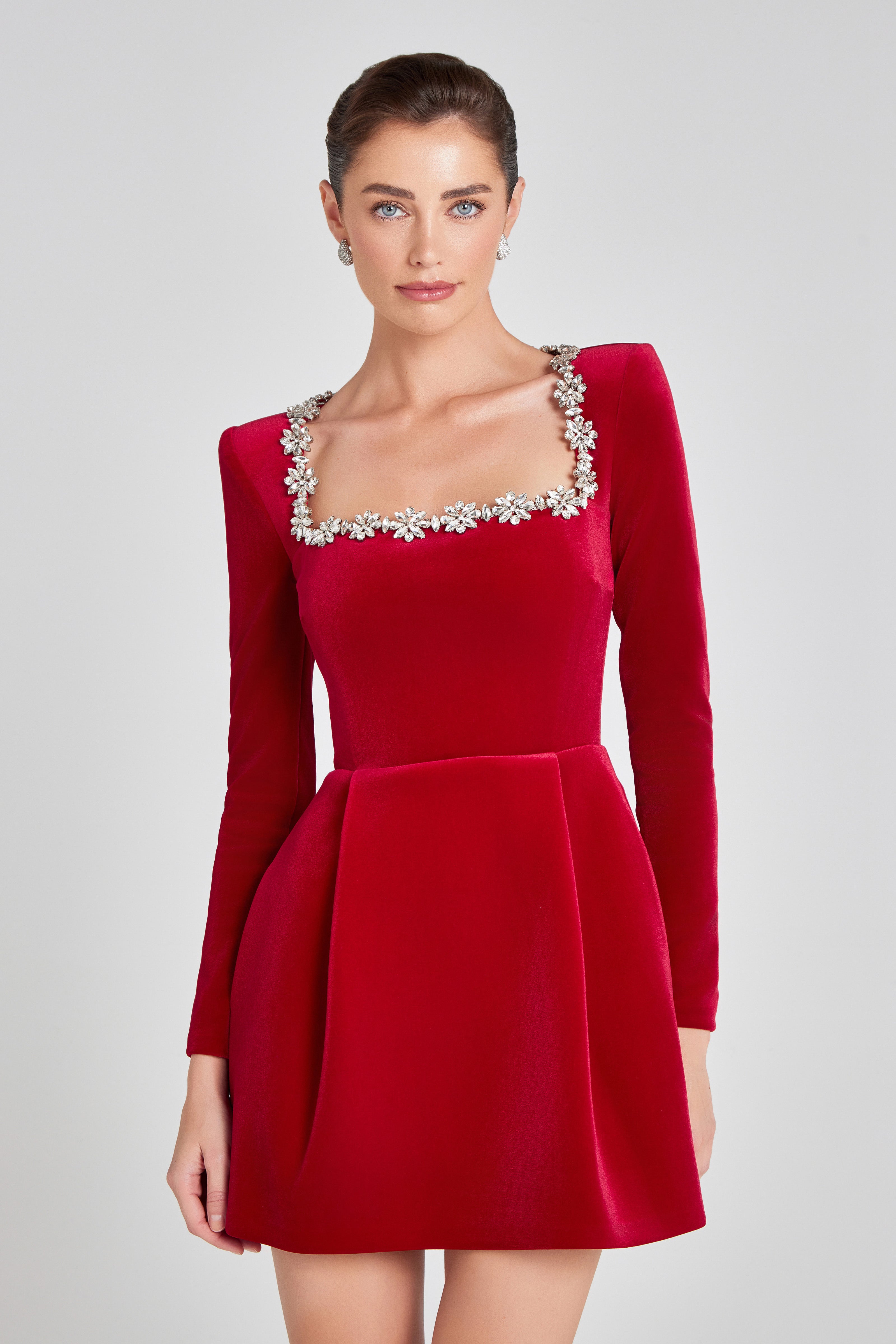 Red velvet mini dress with square crystal neckline and long sleeves for wedding guest wear